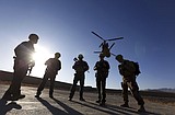 US pauses Afghanistan deployments, isolates arrivals there