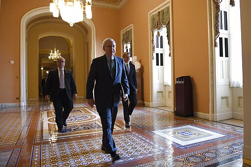 Senate Majority Leader Mitch McConnell of Ky., walks to the Senate floor on Capitol Hill in Washington, Thursday, March 19, 2020. (AP Photo/Susan Walsh)