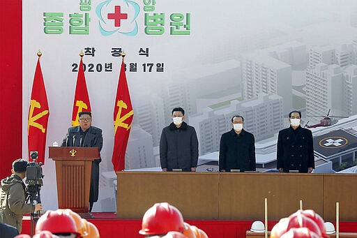 In this Tuesday, March 17, 2020, photo provided on Wendesday, March 18, 2020, by the North Korean government, North Korean leader Kim Jong Un, left, delivers a speech during the ground-breaking ceremony of a general hospital in Pyongyang, North Korea. Kim said it&#146;s &#147;crucial&#148; to improve his country&#146;s health care system during the ceremony, state media reported Wednesday, amid worries about a coronavirus outbreak in the impoverished North. Independent journalists were not given access to cover the event depicted in this image distributed by the North Korean government. The content of this image is as provided and cannot be independently verified.(Korean Central News Agency/Korea News Service via AP)