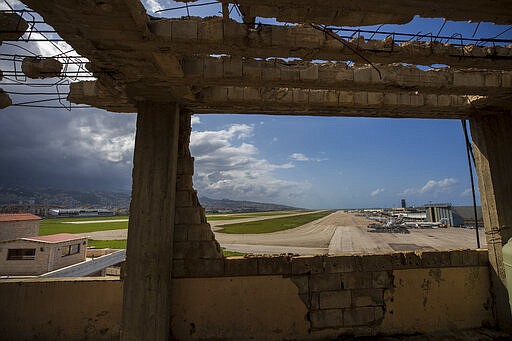 No planes are using the runway at Rafik Hariri International Airport in Beirut, Lebanon, Thursday, March 19, 2020. The Lebanese government decided to shut down the airport, ports and borders and ordered its citizens to stay home as the small country of nearly 5 million grappled with containing the coronavirus. (AP Photo/Hassan Ammar)