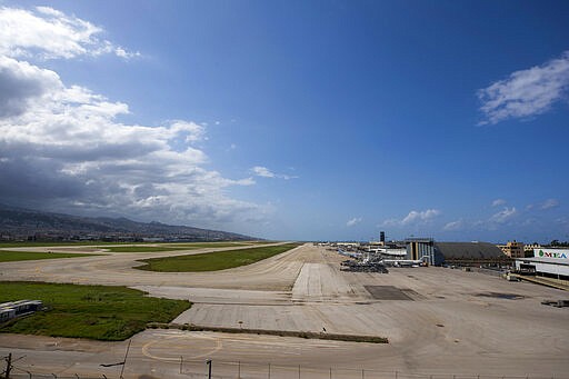 Planes are grounded at Rafik Hariri International Airport in Beirut, Lebanon, Thursday, March 19, 2020. The Lebanese government decided to shut down the airport, ports and borders and ordered its citizens to stay home as the small country of nearly 5 million grappled with containing the coronavirus. (AP Photo/Hassan Ammar)