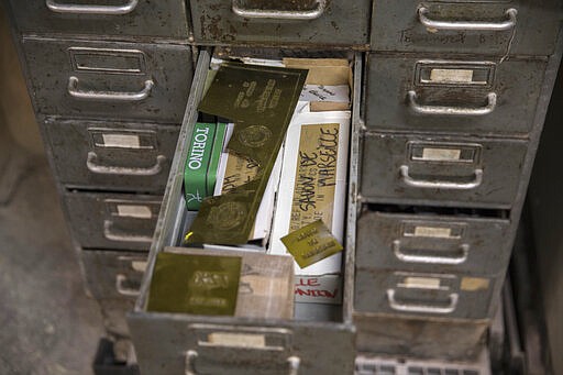 In this photo taken Monday March 16 2020 a drawer full of soap stamps, at the Licorne soap factory in Marseille, southern France. Amid the rapid outbreak of the new coronavirus across Europe, the hallmark Marseille tradition of soap-making is enjoying a renaissance, as the French public rediscovers this essential local product. (AP Photo/Daniel Cole)