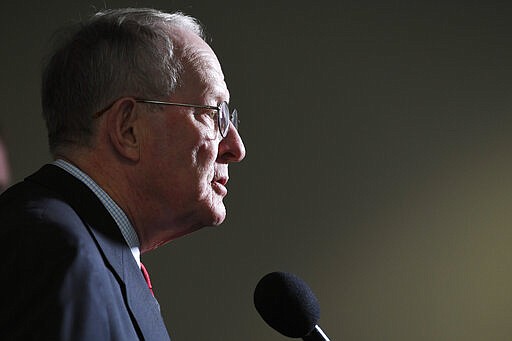 Sen. Lamar Alexander, R-Tenn., talks with reporters following a Republican policy lunch on Capitol Hill in Washington, Thursday, March 19, 2020. (AP Photo/Susan Walsh)