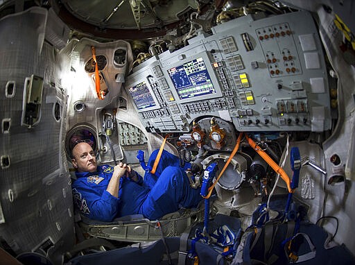 FILE - In this Wednesday, March 4, 2015 photo provided by NASA, astronaut Scott Kelly sits inside a Soyuz simulator at the Gagarin Cosmonaut Training Center (GCTC) in Star City, Russia. Astronaut wannabe Rachel Zimmerman-Brachman, a public engagement specialist at NASA's Jet Propulsion Laboratory, says that isolation is a lot like astronaut training. On Thursday, March 19, 2020, she wrote on Facebook,&#160;&#147;Attitude is everything: I'm on an adventure in a confined space with a small crew for a long duration mission, with occasional space walks and resupply missions. &#160;Sounds like astronaut training to me.&#148;&#160;(Bill Ingalls/NASA via AP)