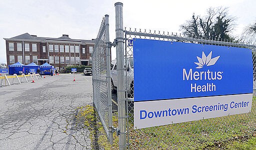 A Meritus Health screening center for COVID-19 is set up in the parking lot of the former Surrey School in Hagerstown, Md., Thursday, March 19, 2020. According to Meritus spokeswoman Joelle Butler, the site is not yet open. The hope is to open next week.  (Colleen McGrath/The Herald-Mail via AP)