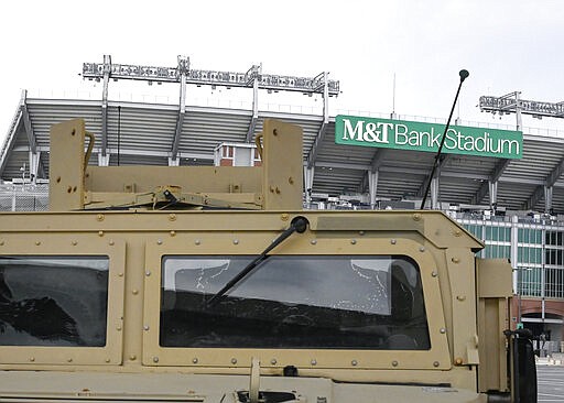 A number of armored transports sit parked in the lot between Camden Yards and M&amp;T Bank Stadium in Baltimore, M.D. The National Guard has been deployed in Maryland. (Ulysses Mu&ntilde;oz/The Baltimore Sun via AP)