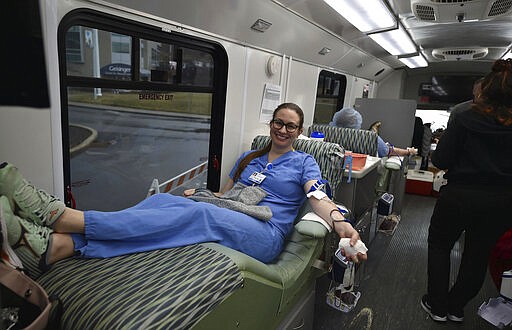 Desiree Wagner, a pediatrician at Geisinger South Wilkes-Barre, donates blood, Friday, March 20, 2020, at the Miller-Keystone blood mobile in South Wilkes-Barre, Pa. (Aimee Dilger/The Times Leader via AP)