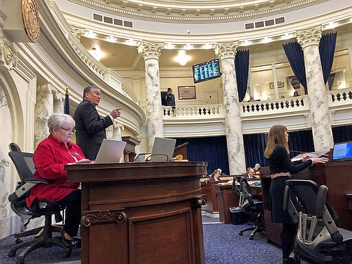 The Idaho House ended its legislative session after balancing fears of spreading the coronavirus with potential vetoes of several bills they will now be powerless to override Friday, March 20, 2020, in Boise, Ohio. The House voted 32-28 Friday to end the session a day after the Senate went home. Republican House Speaker Scott Bedke says that if not for the virus, the House would have remained in session to override vetoes. (AP Photo/Keith Ridler)