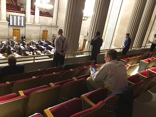 Several Tennessee House members choose to participate Thursday, March 19, 2020 from the gallery amid the coronavirus pandemic in Nashville, Tenn. (AP Photo/Jonathan Mattise)