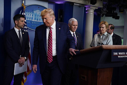 President Donald Trump leaves after speaking at a coronavirus task force briefing at the White House, Friday, March 20, 2020, in Washington. (AP Photo/Evan Vucci)