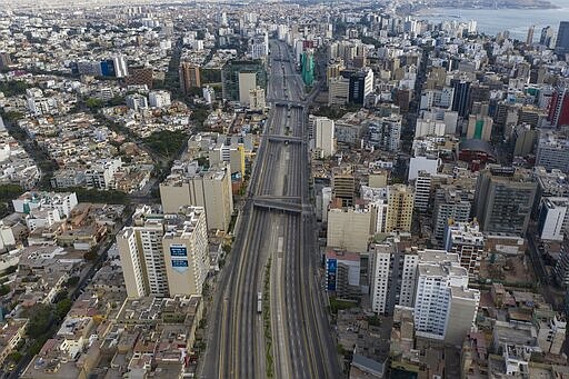 The Via Expresa highway, closed by the government to discourage citizens from circulating, is free of traffic in Lima, Peru, Thursday, March 19, 2020, the fourth day of a state of emergency decreed by the government to prevent the spread of the new coronavirus. (AP Photo/Rodrigo Abd)