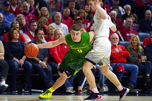 FILE - In this Feb. 22, 2020, file photo, Oregon guard Payton Pritchard (3) drives against Arizona during the first half of an NCAA college basketball game in Tucson, Ariz. Pritchard was selected to The Associated Press All-America first team, Friday, March 20, 2020. (AP Photo/Rick Scuteri, Fle)