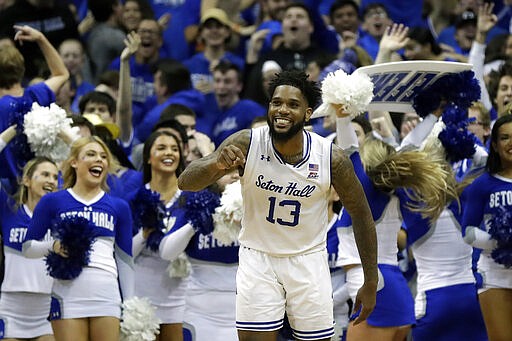 FILE - In this Nov. 14, 2019, file photo, Seton Hall guard Myles Powell (13) reacts against Michigan State during the second half of an NCAA college basketball game in Newark, N.J. Powell was selected to The Associated Press All-America first team, Friday, March 20, 2020.  (AP Photo/Adam Hunger, File)