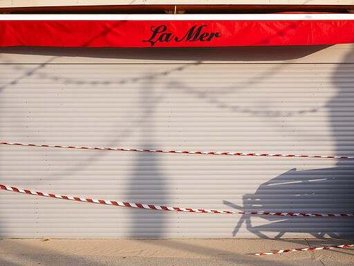 This Thursday, March 19, 2020 photo shows a shut restaurant at Tel Aviv's beachfront wrapped in tape to prevent public access. Israel has reported a steady increase in confirmed cases despite imposing strict travel bans and quarantine measures more than two weeks ago. Authorities recently ordered the closure of all non-essential businesses and encouraged people to work from home. (AP Photo/Oded Balilty)