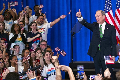 Former Democratic presidential candidate Mike Bloomberg gestures to supporters as he announces the suspension of his campaign and his endorsement of former Vice President Joe Biden for president in New York Wednesday , March 4, 2020. (AP Photo/Eduardo Munoz Alvarez)