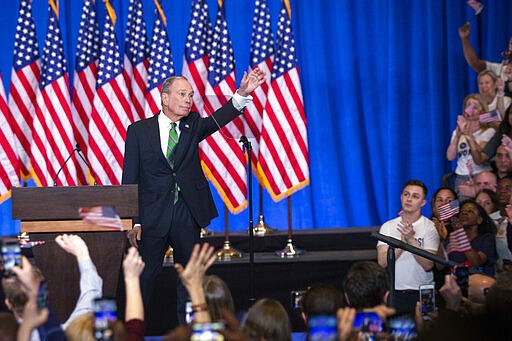 Former Democratic presidential candidate Mike Bloomberg waves to supporters as he announces the suspension of his campaign and his endorsement of former Vice President Joe Biden for president in New York Wednesday , March 4, 2020. (AP Photo/Eduardo Munoz Alvarez)