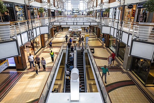 The shopping mall at the popular Victoria and Alfred (V&amp;A) Waterfront in Cape Town South Africa Friday March, 20, 2020, is virtually deserted as plans are in place to prevent the spread of the coronavirus. For most people the virus causes mild or moderate symptoms, but for others it causes severe illness. (AP Photo)