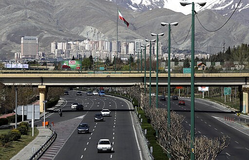 Cars drive in a highway in northern Tehran, Iran, Friday, March 20, 2020, on the first day of Iranian New Year, called Nowruz, or &quot;New Day&quot; in Farsi, the Persian holiday marking the the spring equinox. The new coronavirus has cut into the ancient Nowruz and has further slowed the Islamic Republic's economy. (AP Photo/Vahid Salemi)