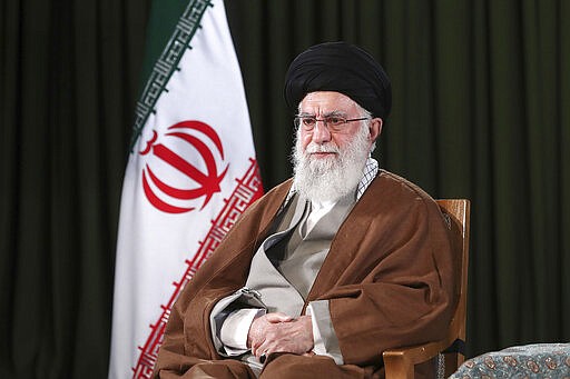 In this photo released on Friday, March 20, 2020 by the official website of the office of the Iranian supreme leader, Supreme Leader Ayatollah Ali Khamenei poses for a portrait prior to delivering his message for the Iranian New Year, or Nowruz, in Tehran, Iran. Ayatollah Ali Khamenei and President Hassan Rouhani in separate new year messages vowed to overcome the new coronavirus and increase economic growth. (Office of the Iranian Supreme Leader via AP)