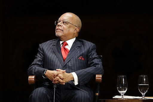 FILE - In this Oct. 22, 2019, file photo, Harvard Professor Henry Louis Gates, Jr. listens during ceremonies on campus where W.E.B. Dubois Medals were awarded for contributions to black history and culture in Cambridge, Mass. Gates help lead a new project launched in March 2020 by the Hutchins Center for African and African American Research at Harvard University and a coalition of foundations to bring online, interactive lessons about Selma and voting rights to students who are home from school due to the novel coronavirus.  (AP Photo/Elise Amendola, File)