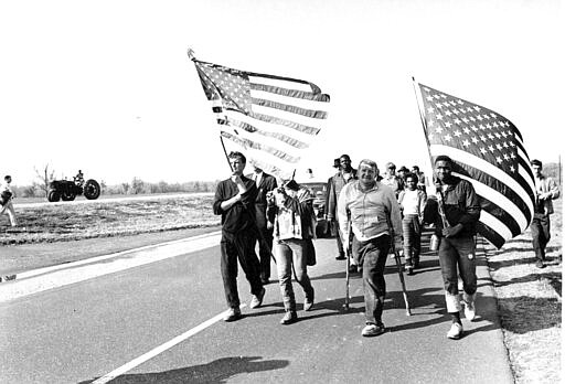 FILE - In this March 24, 1965, file photo, civil rights marchers carry flags and play the flute as they approach their goal from Selma to Montgomery, Alabama's state Capitol. A new online project by the Hutchins Center for African and African American Research at Harvard University seeks to bring the lessons of voting rights to students. The center unveiled in March 2020 Selma Online?. Harvard scholar Henry Louis Gates Jr. says the project will engage students at home because of the coronavirus outbreak and comes as the nation prepares for a presidential election. (AP Photo, File)