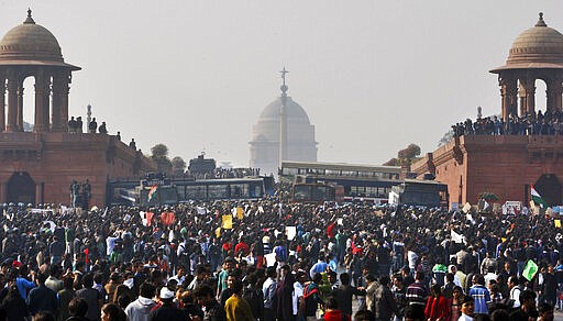 FILE - In this Dec. 22, 2012, file photo, protesters gather outside the Indian Presidential Palace during a protest against the brutal gang rape of a 23-year-old woman on a moving bus in New Delhi, India. Four men sentenced for capital punishment for the 2012 gang-rape of a 23-year-old physiotherapy student on a moving bus in New Delhi have been executed. The men were hanged Friday morning, March 20, 2020, at Tihar Jail in New Delhi. (AP Photo/Tsering Topgyal, File)