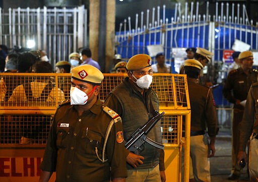 Policemen stand guard at the entrance of Tihar central prison where four men were sentenced to capital punishment in New Delhi, India, Friday, March 20, 2020. Four men sentenced to death for the gruesome gang rape and murder of a woman on a New Delhi bus in 2012 were hanged Friday, concluding a case that exposed the scope of sexual violence against women in India and prompted horrified Indians to demand swift justice. (AP Photo/Manish Swarup)