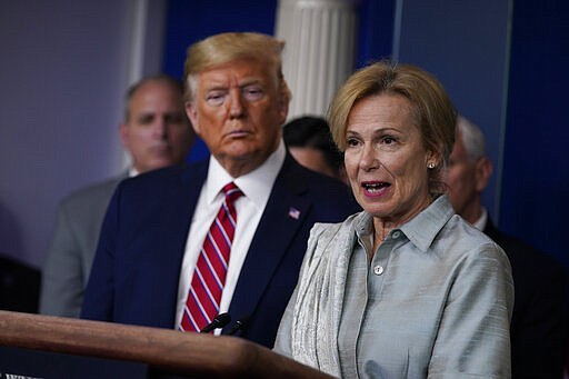 President Donald Trump listens as White House coronavirus response coordinator Dr. Deborah Birx speaks during a coronavirus task force briefing at the White House, Friday, March 20, 2020, in Washington. (AP Photo/Evan Vucci)