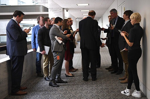 Sen. Richard Shelby, R-Ala., is surrounded by reporters as he stops to talk with them following a Republican policy lunch on Capitol Hill in Washington, Thursday, March 19, 2020. (AP Photo/Susan Walsh)