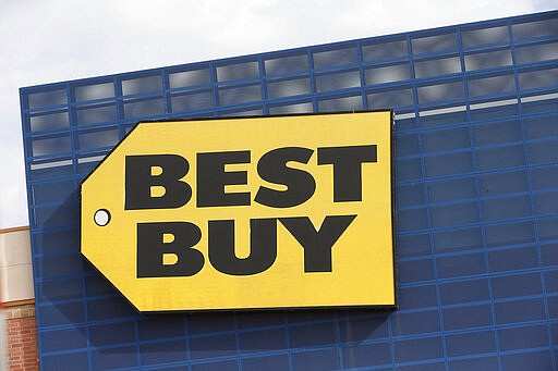 FILE - In this Aug. 27, 2019, file photo, the Best Buy logo is shown on a store in Richfield, Minn. Best Buy, the nation's largest consumer electronics chain, &#160;is temporarily closing its stores, Saturday, March 21, 2020, and moving to curbside delivery service as it tries to curb the spread of the coronavirus. (AP Photo/Jim Mone, File)