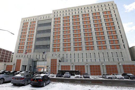 FILE- This Jan. 8, 2017 file photo shows the Metropolitan Detention Center in the Brooklyn borough of New York. The federal Bureau of Prisons announced on Saturday, March 20, 2020, that an inmate at the federal jail has tested positive for coronavirus, marking the first confirmed case in the federal prison system. (AP Photo/Kathy Willens, File)