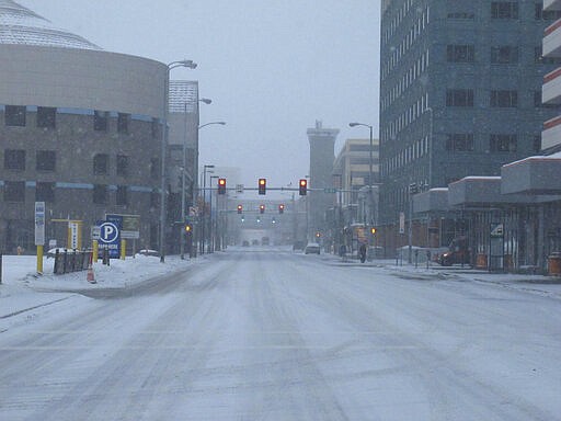 Streets were mostly desolate Saturday, March 21, 2020, in downtown Anchorage, Alaska. Anchorage Mayor Ethan Berkowitz has issued a &quot;hunker down&quot; order, asking everyone to stay at home as much as possible from late Sunday, March 22, until the end of the day March 31, to help control the spread of the coronavirus. Those working in critical jobs are exempt. (AP Photo/Mark Thiessen)