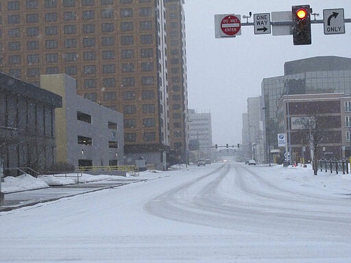 Streets were mostly desolate Saturday, March 21, 2020, in downtown Anchorage, Alaska. Anchorage Mayor Ethan Berkowitz has issued a &quot;hunker down&quot; order, asking everyone to stay at home as much as possible from late Sunday, March 22, until the end of the day March 31, to help control the spread of the coronavirus. Those working in critical jobs are exempt. (AP Photo/Mark Thiessen)