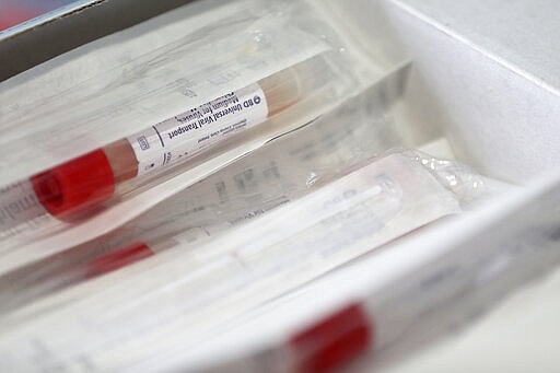 A box of universal viral transport kits &#151; otherwise known as nasal swab kits &#151; are pictured before the city's coronavirus testing site opened next to Citizens Bank Park in South Philadelphia on Friday, March 20, 2020. The site, which opened Friday afternoon, is the first city-run location where people can be swabbed to determine if they have the coronavirus. At the time of opening, it was only for people with symptoms who are over 50 and healthcare workers with symptoms. (Tim Tai/The Philadelphia Inquirer via AP)