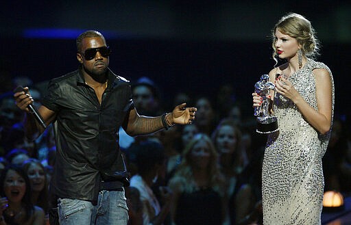 FILE - In this Sept. 13, 2009 file photo, singer Kanye West takes the microphone from singer Taylor Swift as she accepts the &quot;Best Female Video&quot; award during the MTV Video Music Awards  in New York.   Swift may have ended her feud with Katy Perry but the one with Kanye West seems simply not to want to die. New leaked video clip of the entire four-year-old phone call between the rapper and pop superstar about his controversial song &quot;Famous&quot; have been posted online and further complicate the picture of what happened.(AP Photo/Jason DeCrow, File)