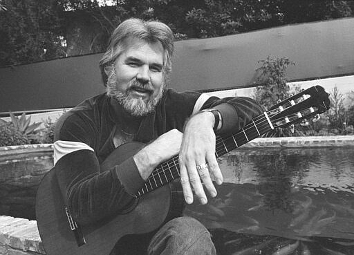FILE - This Feb. 20, 1978 file photo shows Kenny Rogers at his home in Brentwood, Calif.   Rogers, who embodied &#147;The Gambler&#148; persona and whose musical career spanned jazz, folk, country and pop, has died at 81. A representative says Rogers died at home in Georgia on Friday, March 20, 2020.  (AP Photo/Wally Fong, File)