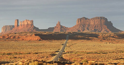 FILE - This Oct. 25, 2018 file photo shows Monument Valley, Utah. In the U.S. Southwest, the leader of the Navajo Nation restricted travel for employees who answer to him and wrote letters to federal officials saying anyone pulled away from duty at federal health care facilities on the vast reservation wouldn't be welcome back for 45 days. Tribes across the country have closed casinos to help slow the spread of the new coronavirus. In the U.S. Southwest, the leader of the Navajo Nation restricted travel for employees who answer to him and wrote letters to federal officials saying anyone pulled away from duty at federal health care facilities on the vast reservation wouldn't be welcome back for 45 days. (AP Photo/Rick Bowmer, File)