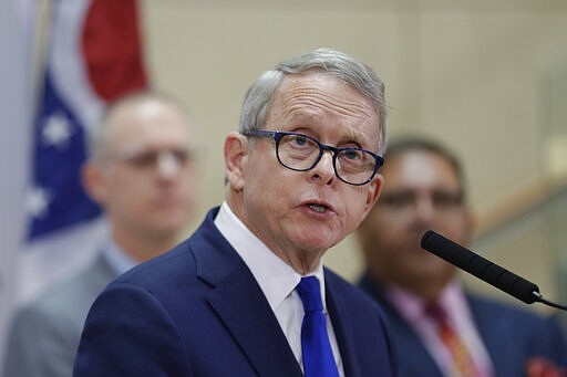 FILE - In this Feb. 27, 2020, file photo Ohio Gov. Mike DeWine gives an update at MetroHealth Medical Center in Cleveland on the state's preparedness and education efforts to limit the potential spread of coronavirus.  &quot;We cannot tell people to stay inside, but also tell them to go out and vote,&#148; said DeWine of Ohio, which postponed its primary that had been scheduled for last Tuesday. (AP Photo/Tony Dejak, File)