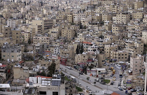 The streets of the Jordanian Capital are seen empty after the start of a nationwide curfew, amid concerns over the coronavirus pandemic, in Amman, Jordan, Saturday , March 21, 2020.  Air raid sirens have echoed across Jordan's capital to mark the start of a three-day curfew. It's the latest mass lockdown in the Middle East aimed at containing the coronavirus (AP Photo/Raad Adayleh)