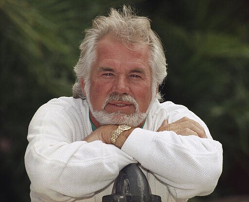 FILE - This May 17, 1989 file photo shows Kenny Rogers posing for a portrait in Los Angeles.   Rogers, who embodied &#147;The Gambler&#148; persona and whose musical career spanned jazz, folk, country and pop, has died at 81. A representative says Rogers died at home in Georgia on Friday, March 20, 2020.  (AP Photo/Bob Galbraith, File)