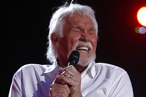 FILE - In this June 9, 2012, file photo, Kenny Rogers performs at the 2012 CMA Music Festival in Nashville, Tenn. Actor-singer Kenny Rogers, the smooth, Grammy-winning balladeer who spanned jazz, folk, country and pop with such hits as &#147;Lucille,&#148; &#147;Lady&#148; and &#147;Islands in the Stream&#148; and embraced his persona as &#147;The Gambler&#148; on record and on TV died Friday night, March 20, 2020. He was 81. (Photo by Wade Payne/Invision/AP, File)