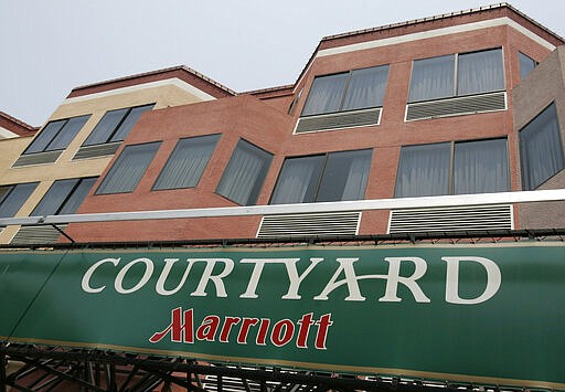 FILE - Exterior of the Courtyard by Marriott Hotel in San Francisco, Calif..is seen in a  July 9, 2008 file photo. Marriott International Inc. said that it will furlough thousands of corporate employees at its U.S. headquarters and globally. The decision, first reported by The Wall Street Journal Sunday,March 22, 2020 adds to massive recent payroll reductions that began last week.  . (AP Photo/Paul Sakuma, File)