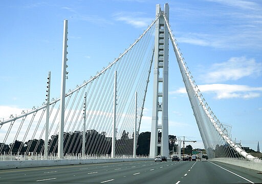 Light traffic is seen on the eastern span of the San Francisco-Oakland Bay Bridge Sunday, March 22, 2020, in San Francisco. Some 40 million Californians are coping with their first weekend under a statewide order requiring them to stay at home to help curb the spread of the coronavirus. (AP Photo/Ben Margot)