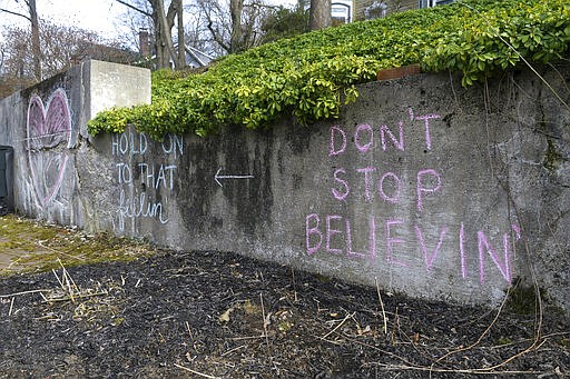 Chalk artwork and inspiration are seen on a wall at the Peters home in Pottsville, Pa., on Sunday, March 22, 2020. (Jacqueline Dormer/Republican-Herald via AP)