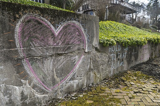 Chalk artwork and inspiration are seen on a wall at the Peters home in Pottsville, Pa., on Sunday, March 22, 2020. (Jacqueline Dormer/Republican-Herald via AP)