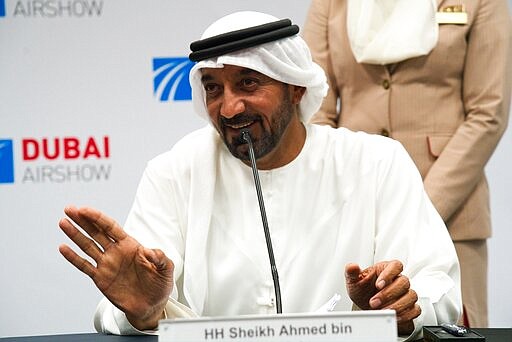 FILE - In this Nov. 20, 2019, file photo, Sheikh Ahmed bin Saeed Al Maktoum, the chairman and CEO of the Dubai-based long-haul carrier Emirates, gives a news conference at the Dubai Airshow in Dubai, United Arab Emirates. On Sunday, March 22, 2020, Sheikh Ahmed announced that the long-haul carrier Emirates would suspend all passenger flights beginning Wednesday, March 25, 2020, over the effects of the global coronavirus pandemic. (AP Photo/Jon Gambrell, File)