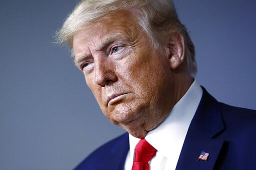 President Donald Trump listens during a coronavirus task force briefing at the White House, Sunday, March 22, 2020, in Washington. (AP Photo/Patrick Semansky)