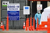 Chaos, inconsistency mark launch of drive-thru virus testing