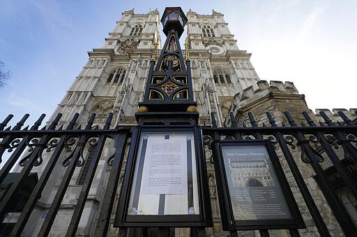 A notice on the gates of Westminster Abbey warning of its closure after places of worship were advised to suspend public gathering for religious services due to COVID-19 Coronavirus, in London, Sunday, March 22, 2020. For some people the coronavirus causes mild or moderate symptoms, such as fever and cough, but for some it can cause more severe illness, including pneumonia.(AP Photo/Kirsty Wigglesworth)