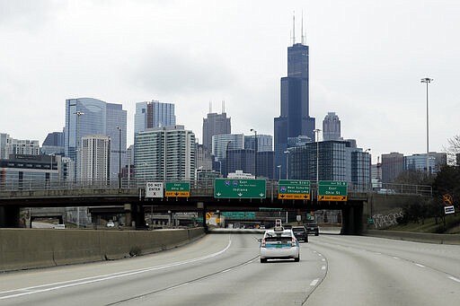 Less traffic on I-94 South bound in Chicago, Sunday, March 22, 2020. Gov. J.B. Pritzker on Friday issued a stay-at-home order, the most strict statewide action he's taken to date in the effort to prevent further spread of the new coronavirus. Pritzker's order follows statewide schools closures, restrictions on the size of gatherings, and an order for bars and restaurants to suspend dine-in service. (AP Photo/Nam Y. Huh)